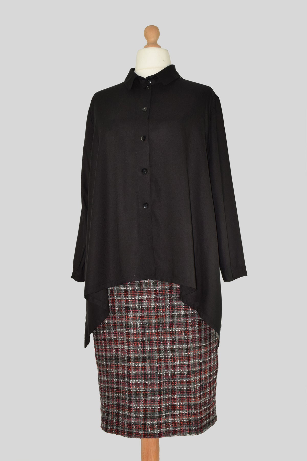 Full body featuring back shirt and checked skirt